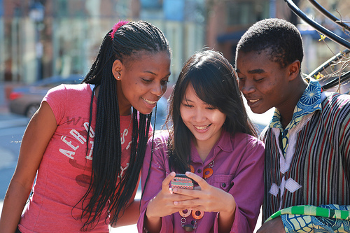 Millennials Using A Smart Cell Phone